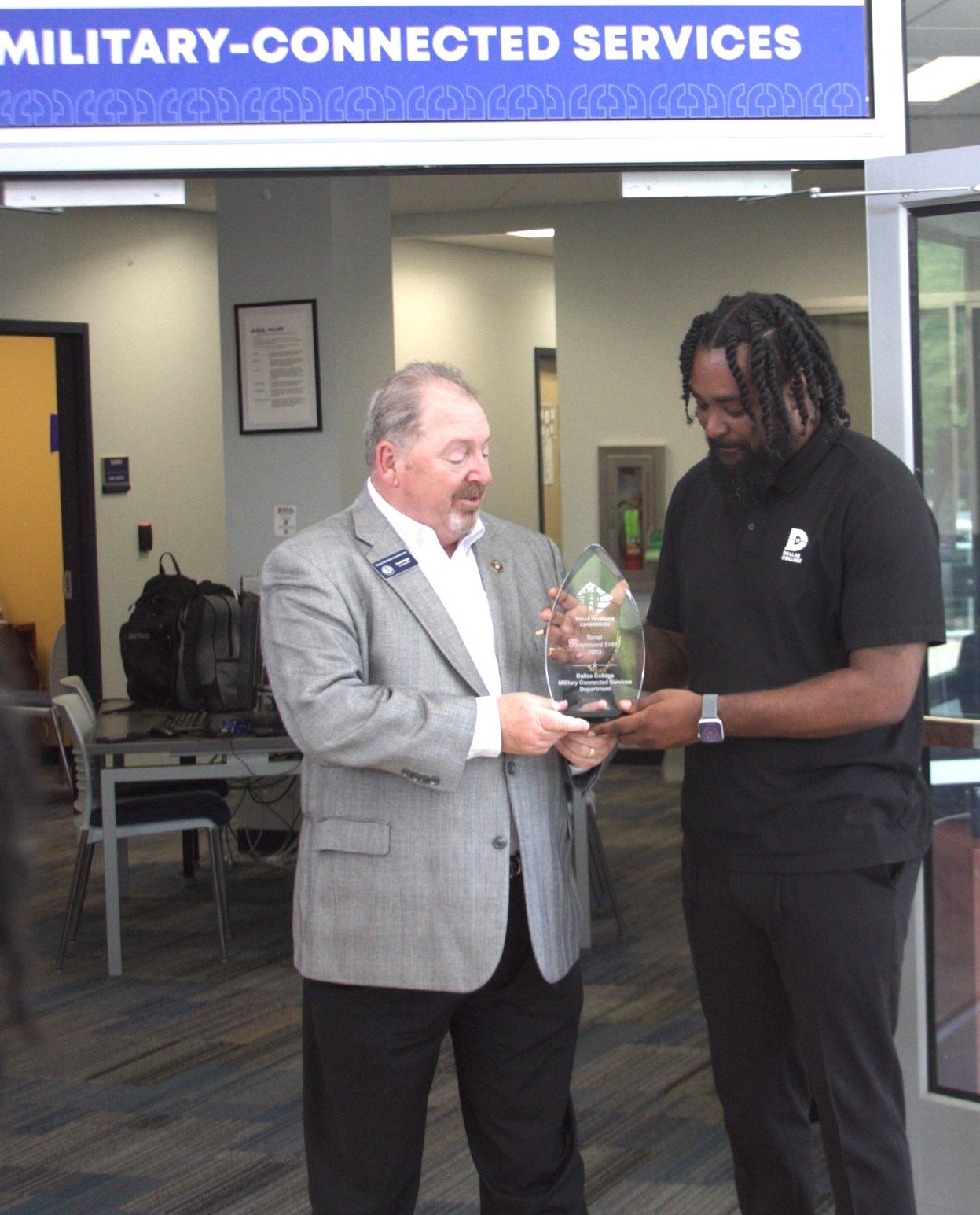TVC Commissioner Wright presents the Veteran Employer award to Dallas College - Veteran Connected Services Department